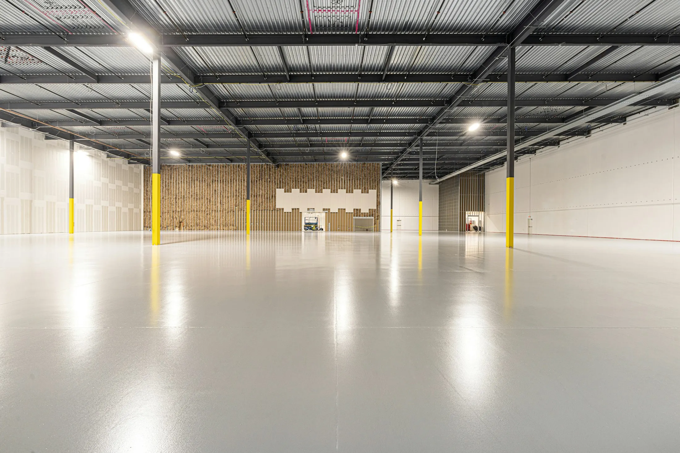 Empty modern interior with a ground and sealed concrete floor